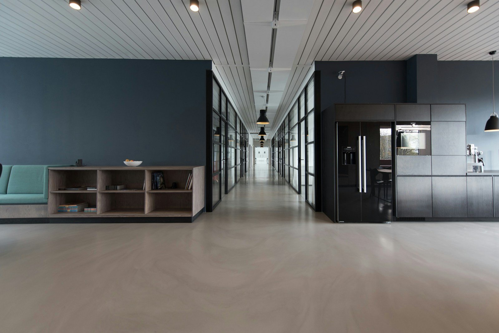 Holistic luxury interior integrating stretch ceiling, fluted walls, wood flooring, and layered lighting